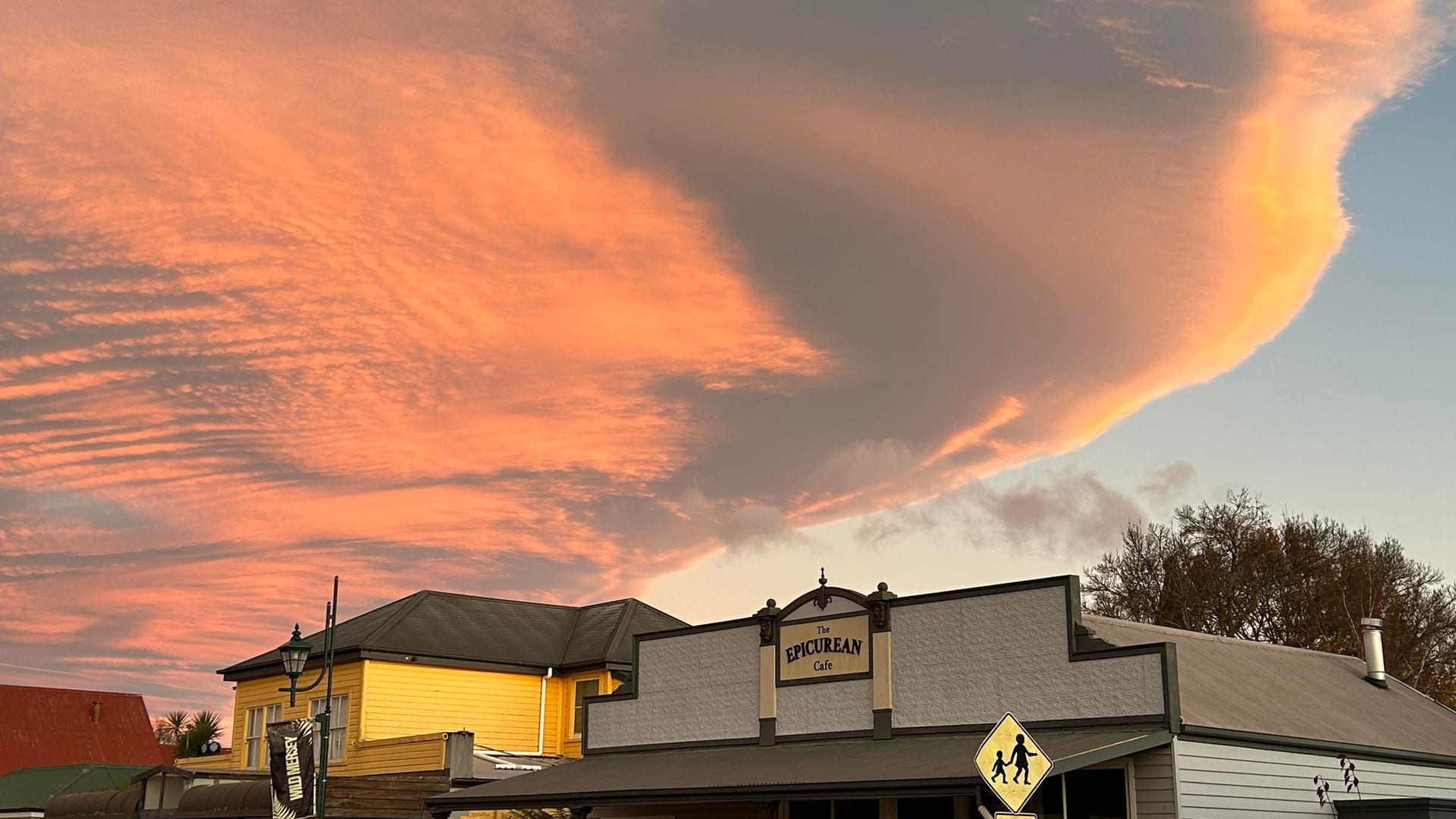 The Epicurean Cafe on Main Street, Sheffield, under a dramatic dusk sky